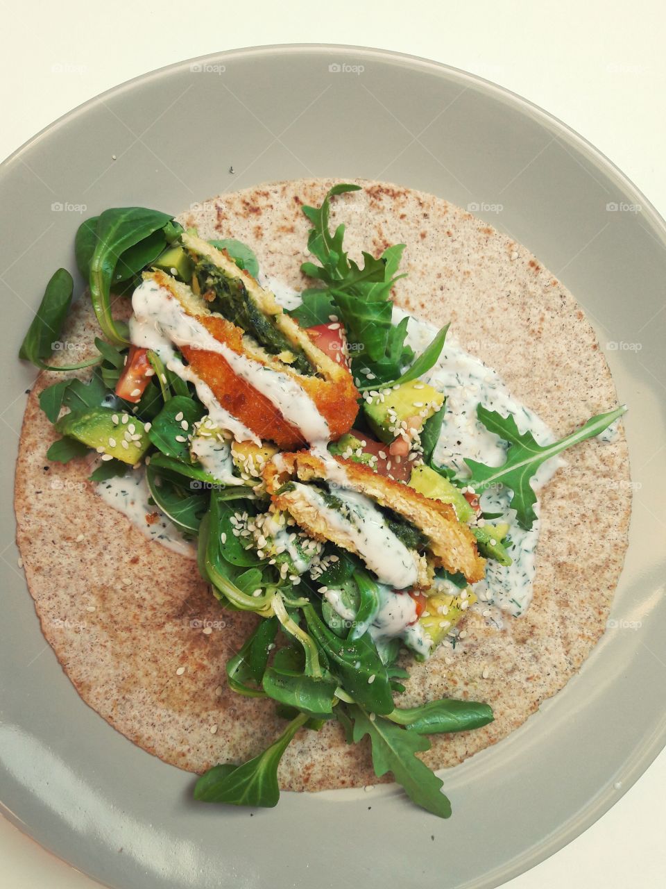Healthy meal wraps avocado chicken sesam