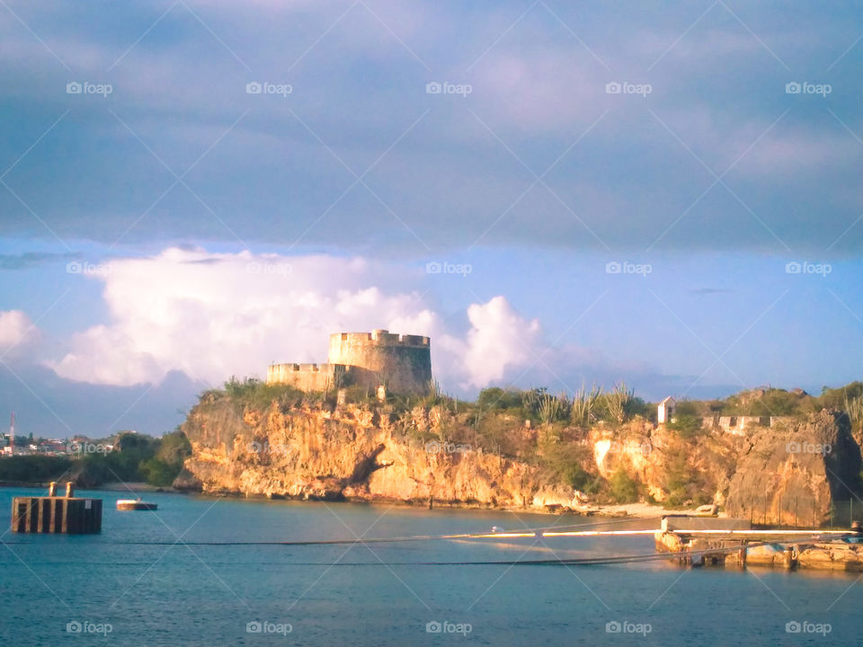 local monument, fort at baya beach, ocean view cloudy skies