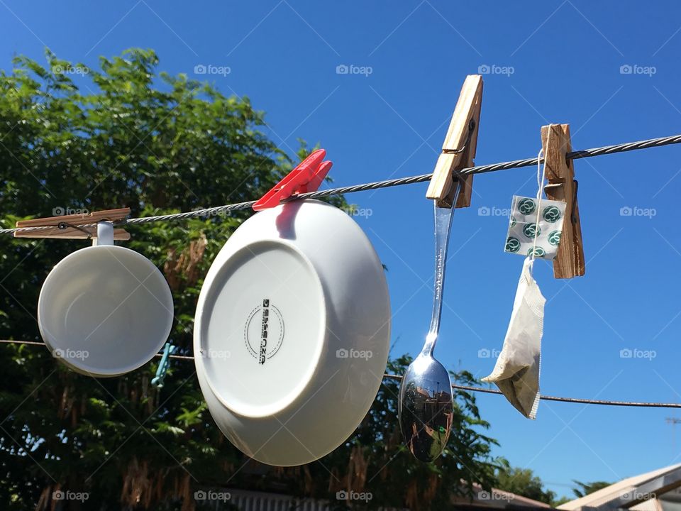 Solar and wind power, dishes and cutlery hanging to dry tongue in cheek imagery 