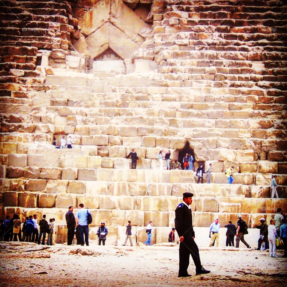 At the base of the Great Pyramid of Giza. The oldest and largest of the 3 pyramids in the Giza pyramid complex.