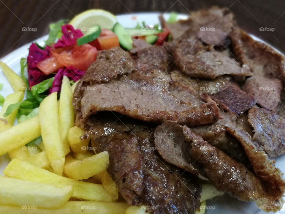 Lamb doner kebab. Turkish dishes.