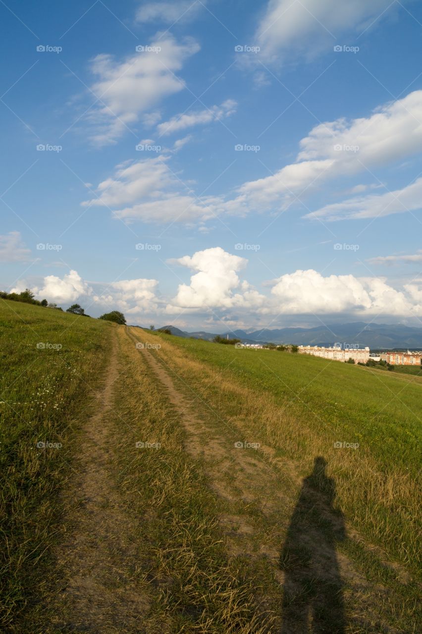 shadow of a person walking in the nature