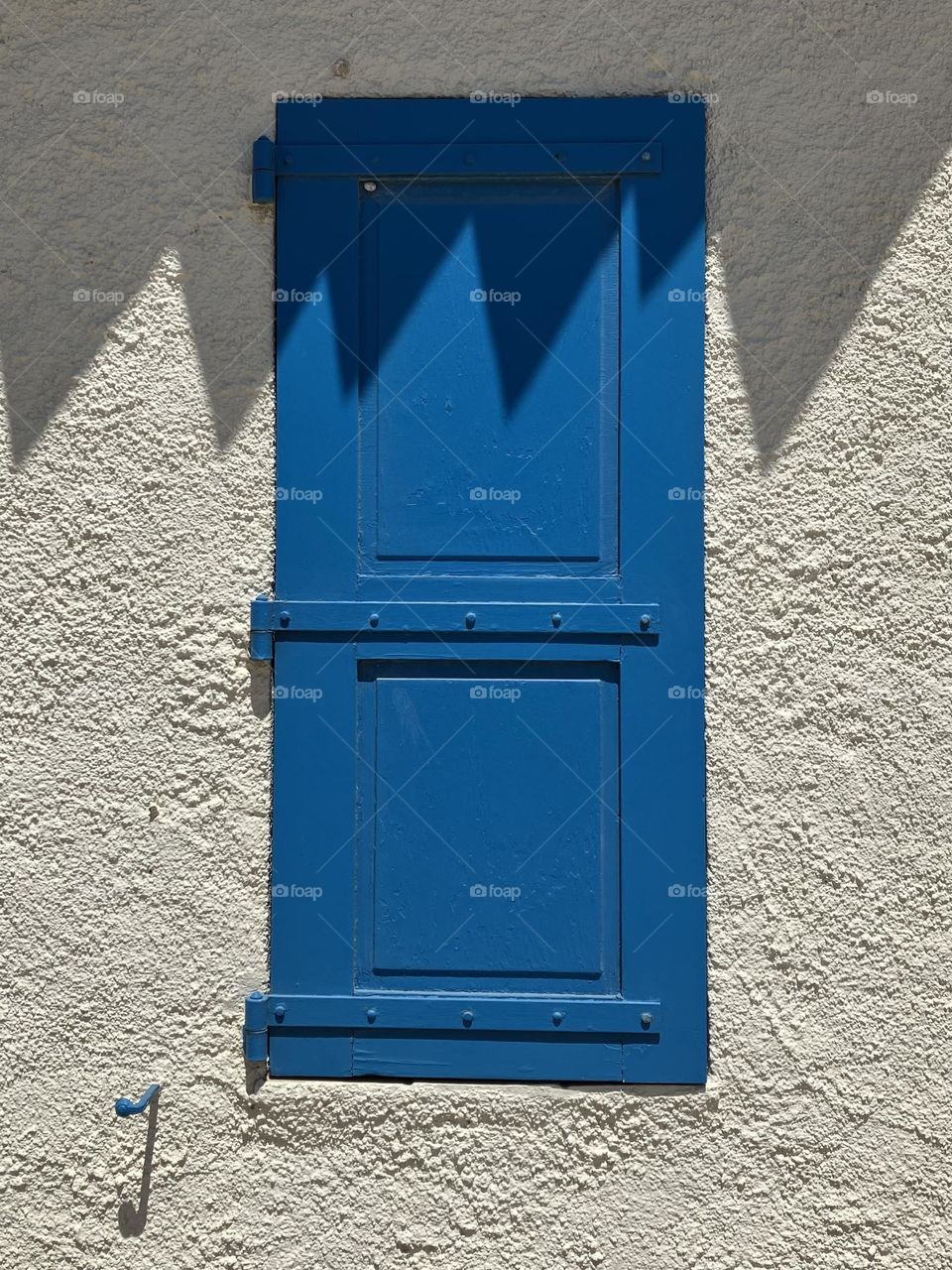 Sunny closed blue shutter
