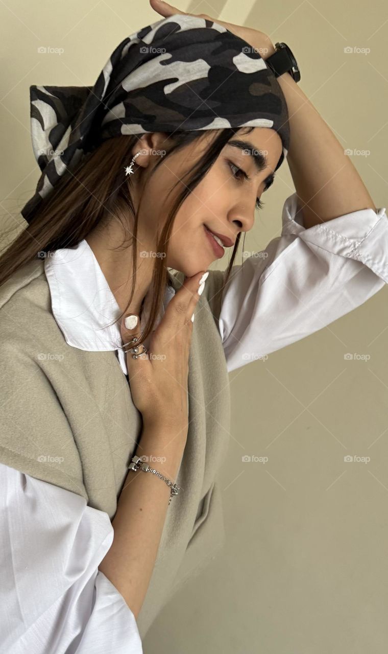 An image of a girl's face full of peace with a very interesting figure staring at a corner