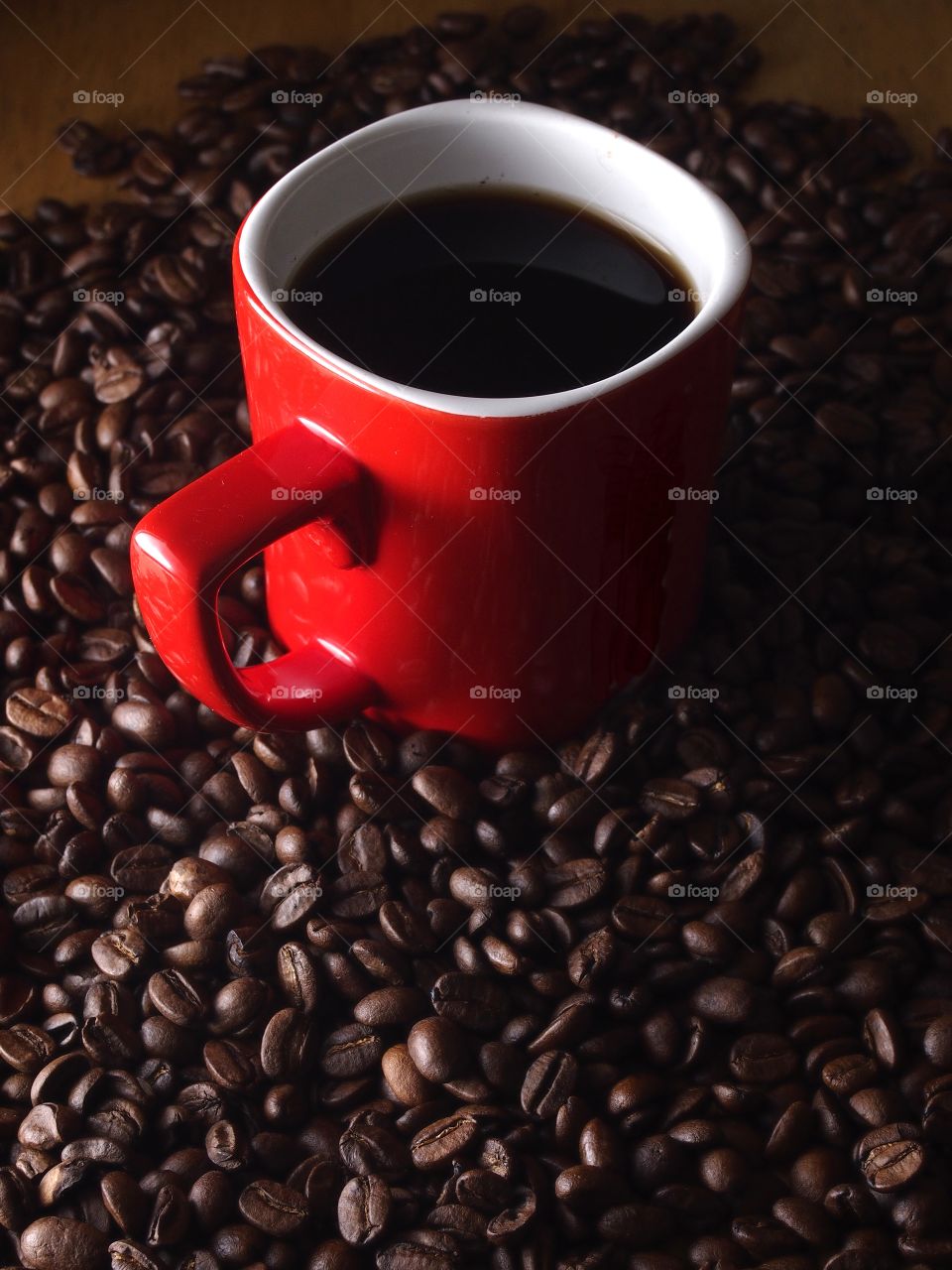mug of coffee and coffee beans. mug of coffee and coffee beans