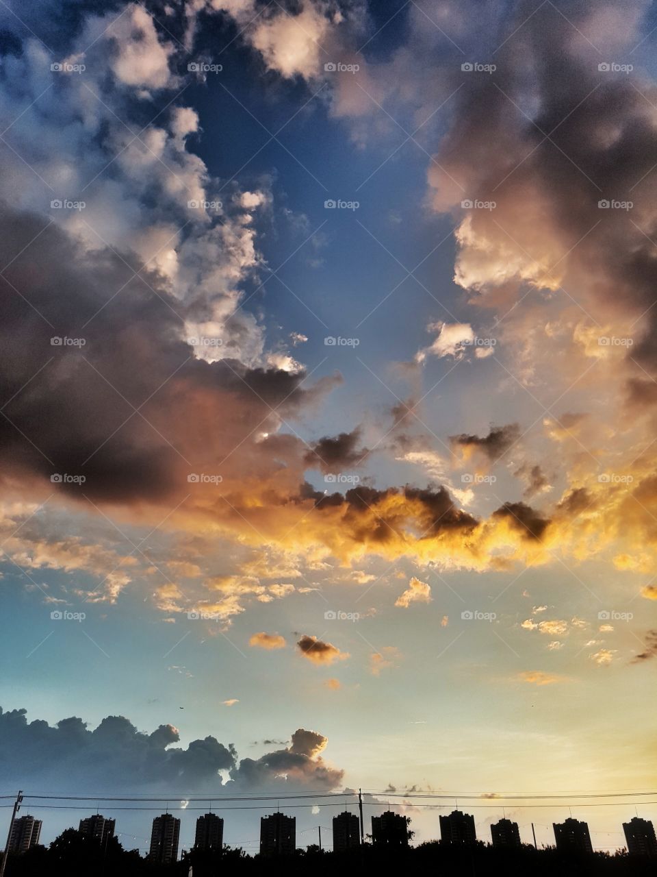 silhouette of building on a colorful cloudy sunset sky