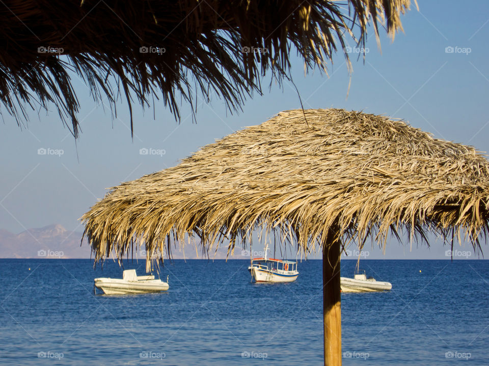 Umbrella and boats. 