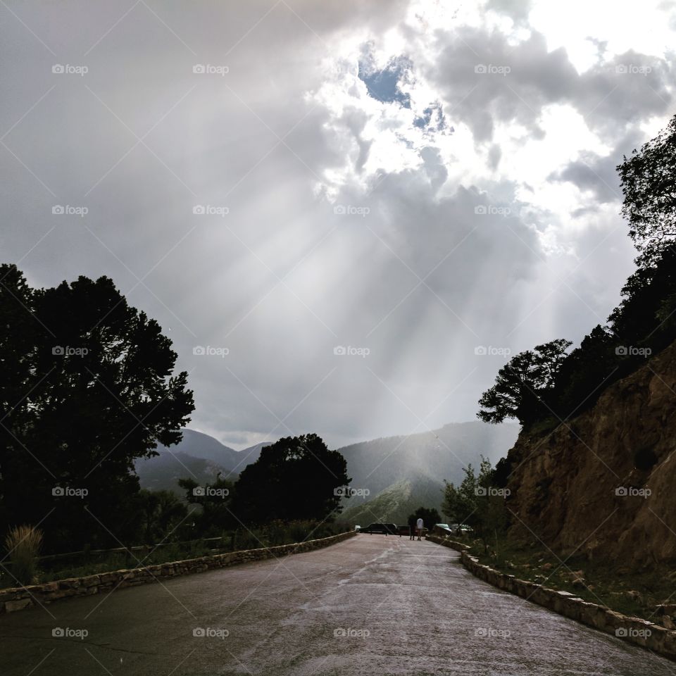 Mountain sun rays on a cloudy day