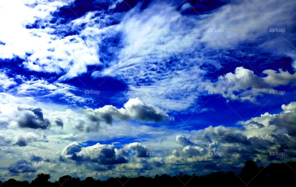 Dark blue sky with beautiful clouds.