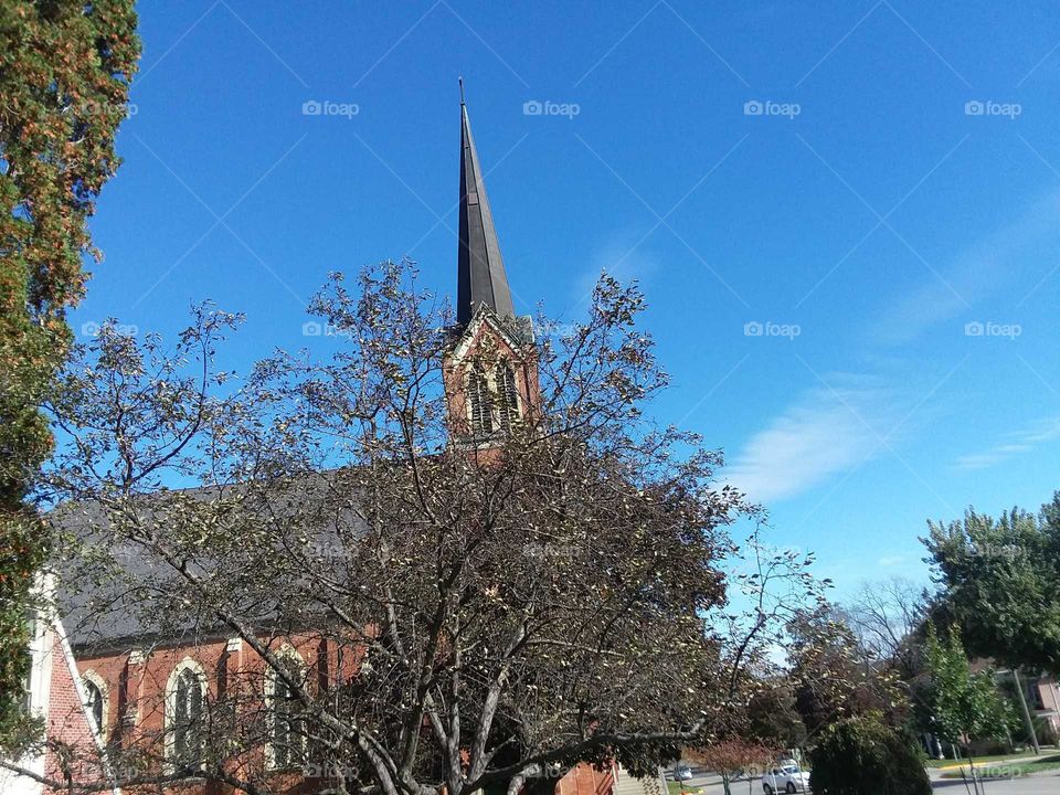 church blue steeple peak trees