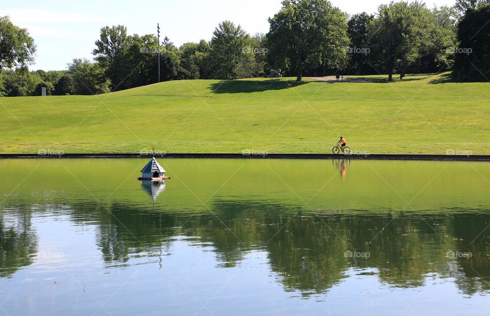 Man biking by lake