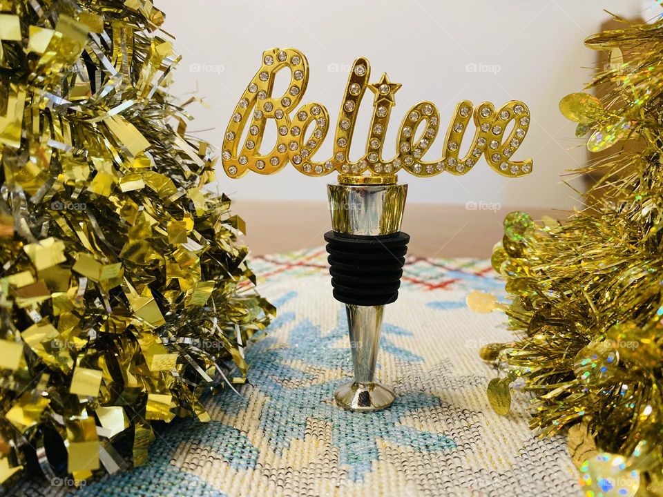 Wine bottle stopper that says “Believe” 