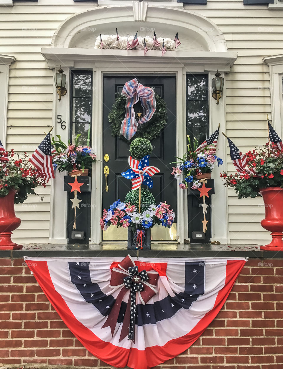 Small town patriotism in Wickford, RI.  A front step decorated with the red, white and blue. 