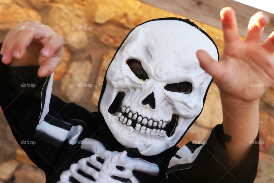 A child in skeleton costume at Halloween