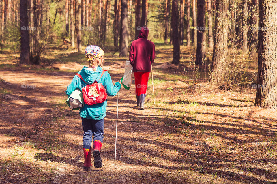 Kids are walking in the forest