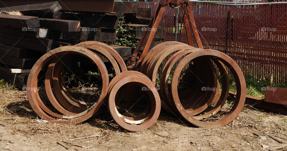 Rusting machinery part and rotting wood beams