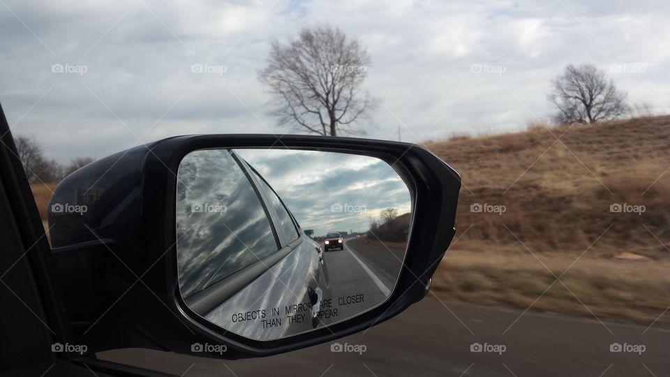 Car mirror road reflection