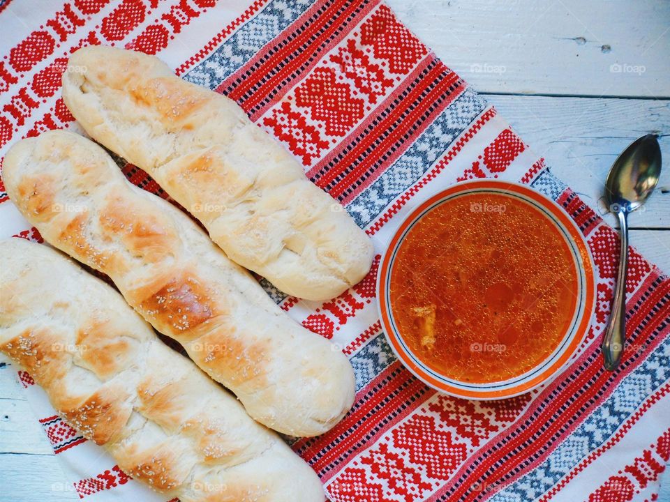 Ukrainian soup and homemade bread on the table