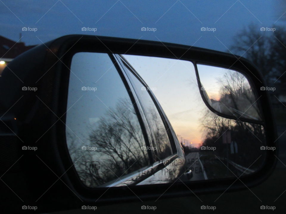 Car side mirror with sunset