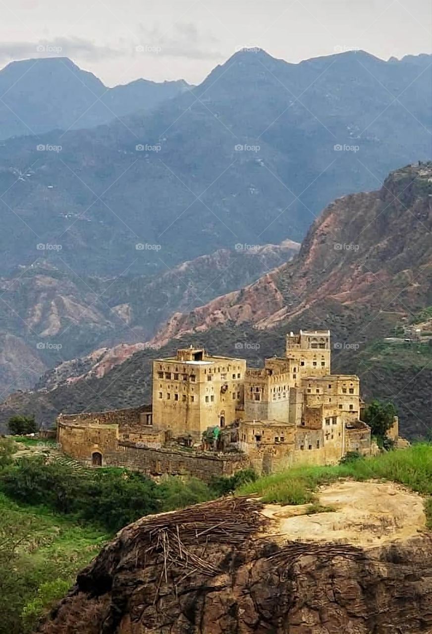 A stunning view of green mountains covered in fog in Yemen
