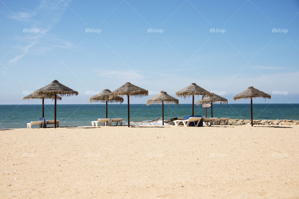 parasols on tropical beach. parasols on tropical beach in Portugal 