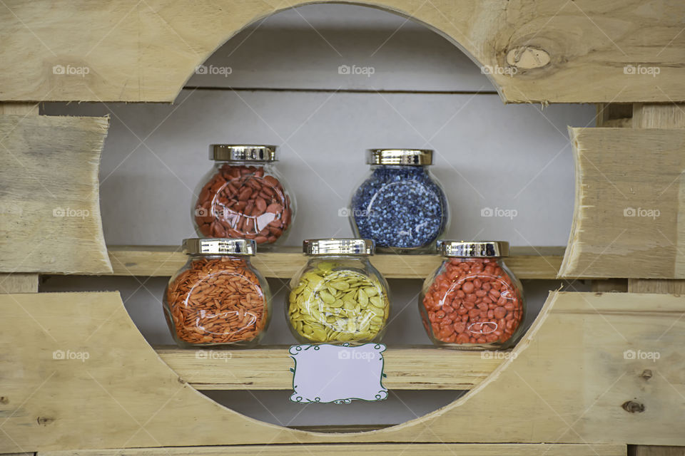 Seed corn and melon coated in glass bottles.