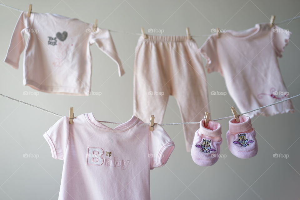 Baby laundry hanging on a clothesline