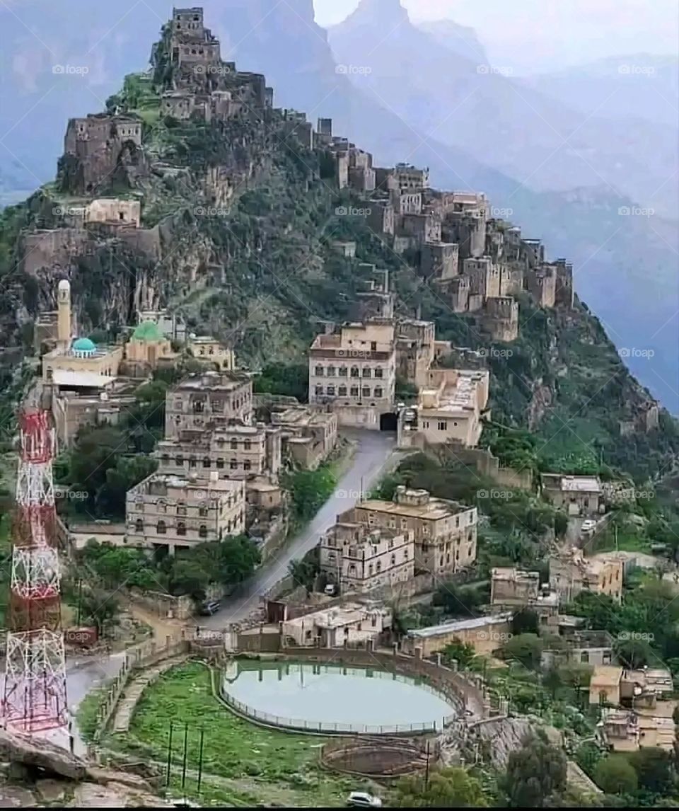 A stunning view of green mountains covered in fog in Yemen