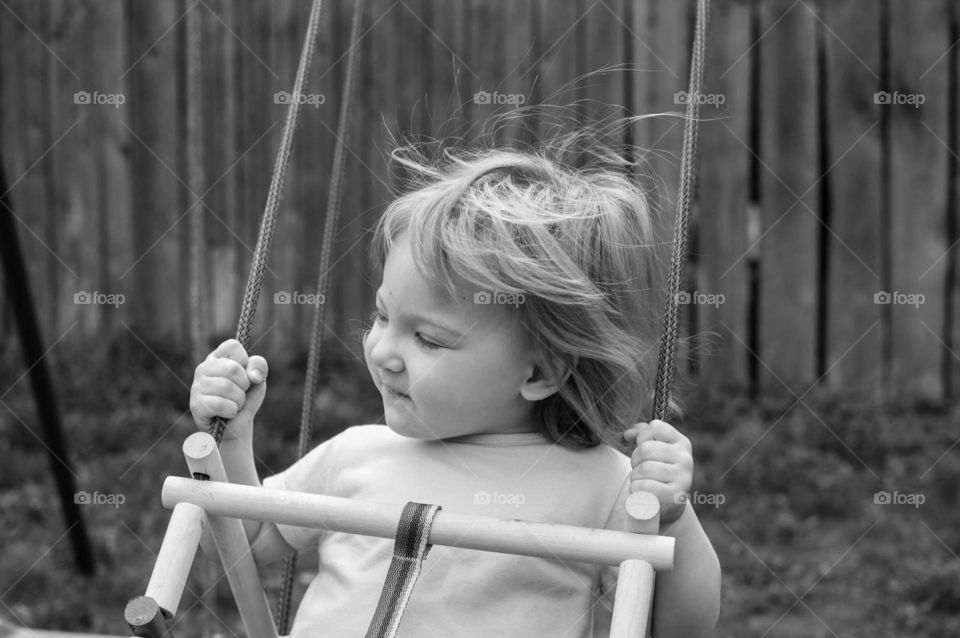 lovely young girl on a swing
