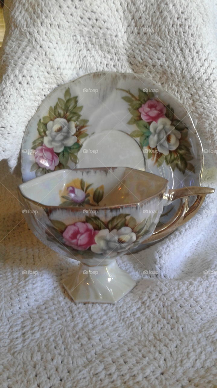 Beautiful  unique floral teacup and matching plate and white lace background