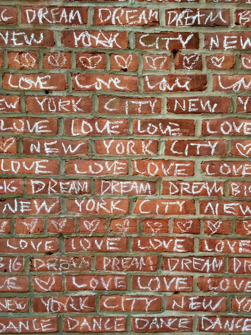 Writing on the wall 2. Message on a brick wall in soho 