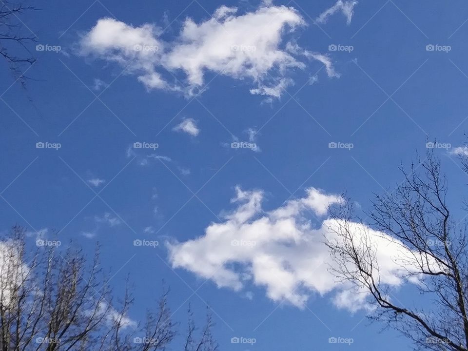 two clouds falling apart