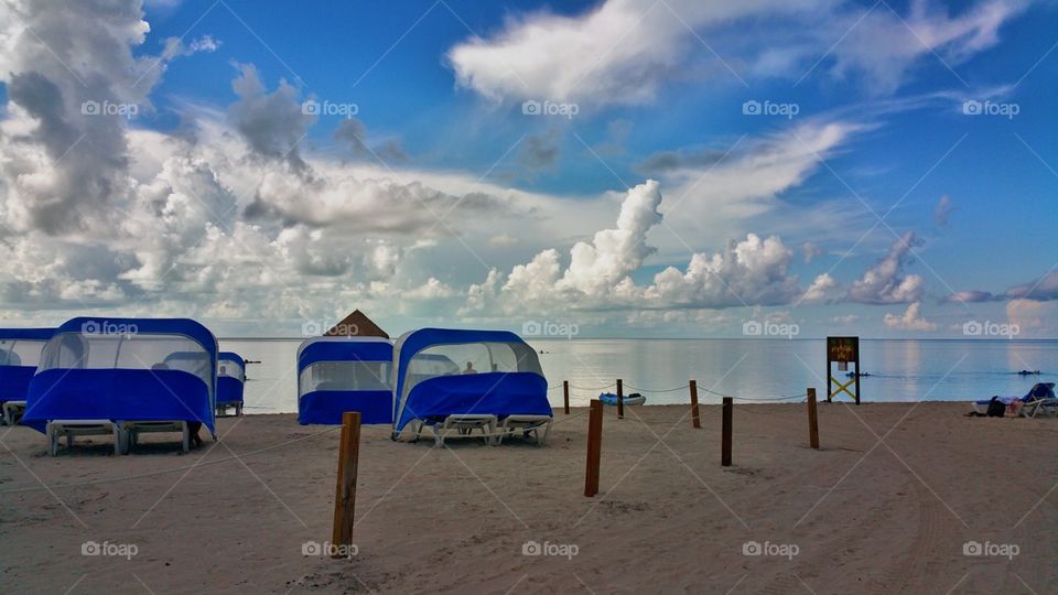 Beautiful early morning views..I ocean looks like ice and clouds with cabana.. Coco cay Bahama's