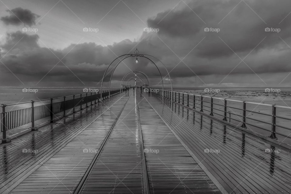 Black and white pier moody atmosphere 