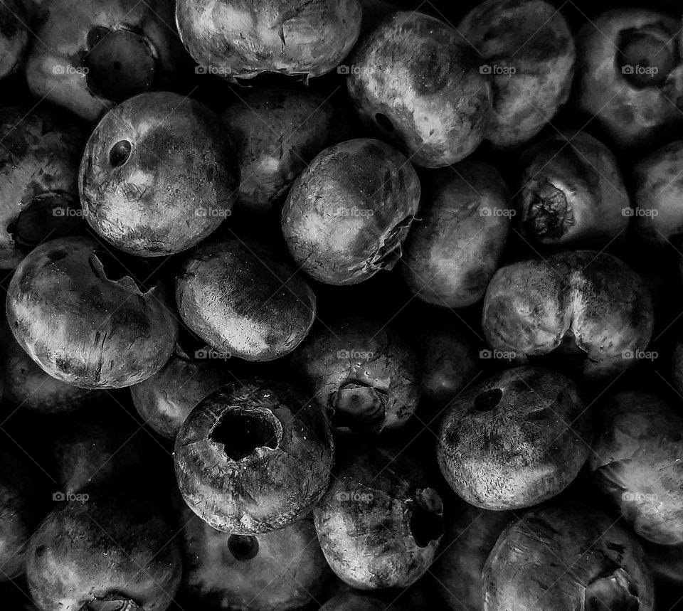 black and white macro photo of fruits, namely rowan berries