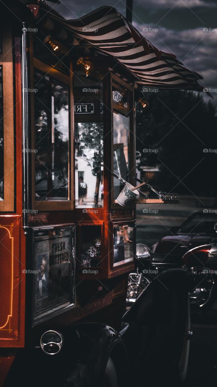 Popcorn stand and it beautiful reflection.