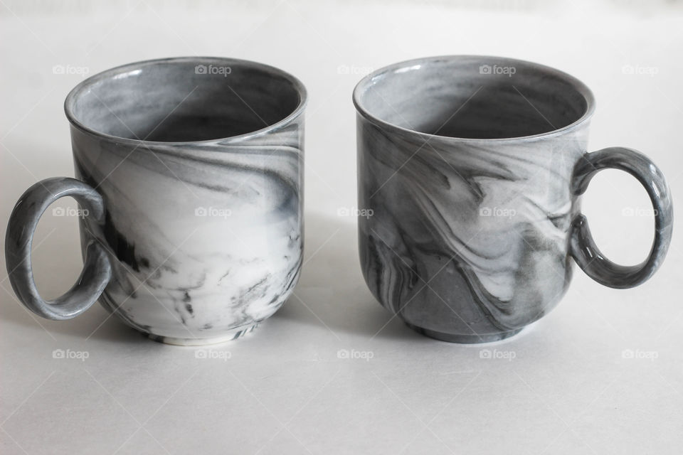 Two marble coffee cups