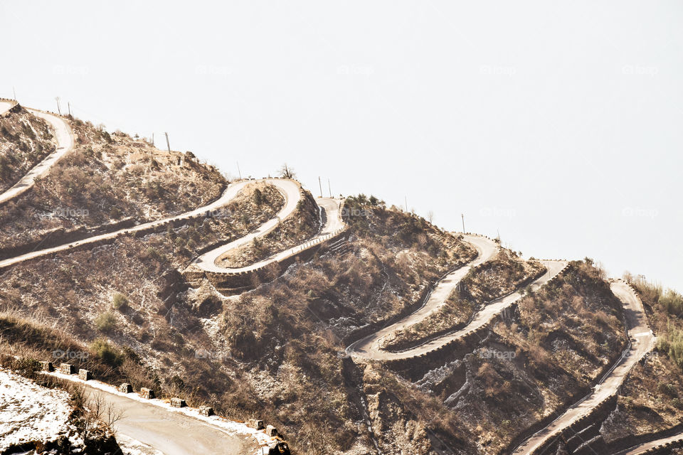 Rugged terrain of lower Himalayas in East Sikkim, Zuluk or Dzuluk, from Thambi View Point. Winding road of 32 hairpin turns. Historic Silk Route from Tibet to India. Offbeat destination in East Sikkim