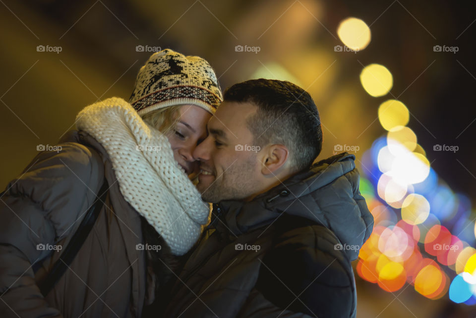 Couple in love on street lights background