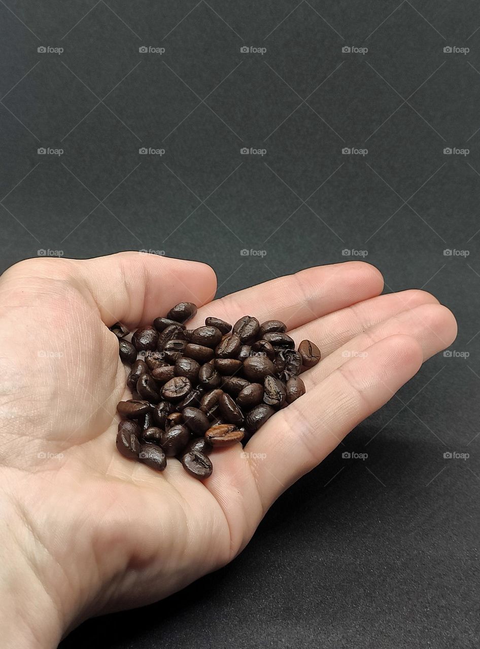 coffee beans in hand