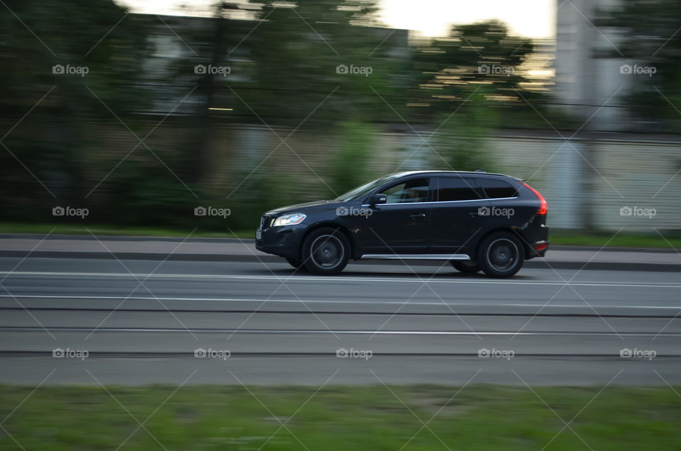 Black Volvo in motion