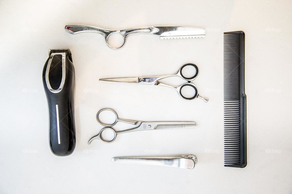 Hair Scissors And Razor Photo

Tools at a hair salon laid out in perfect form and ready for the next cut, trim, shave or style.