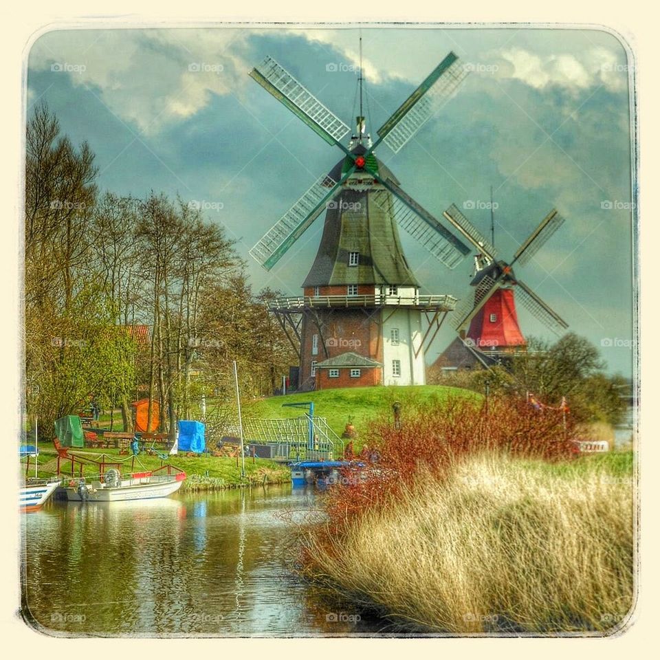 Red and Green Windmills in Greetsiel