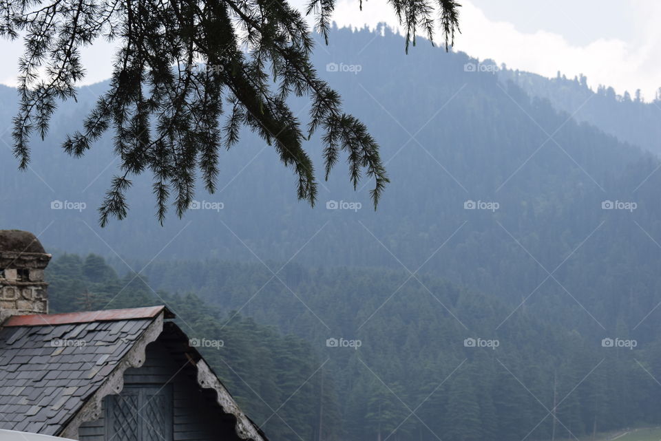 House Roof Top Set Against The Mountain