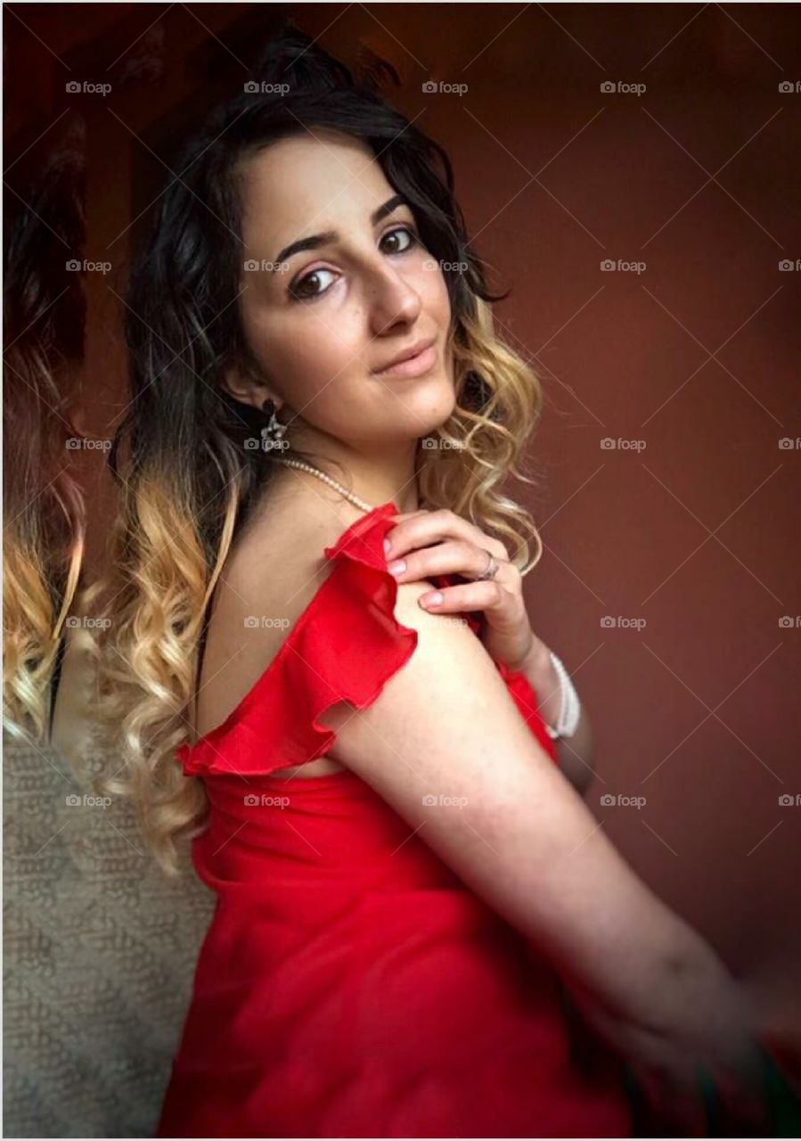 Beautiful girl in a lovely red dress