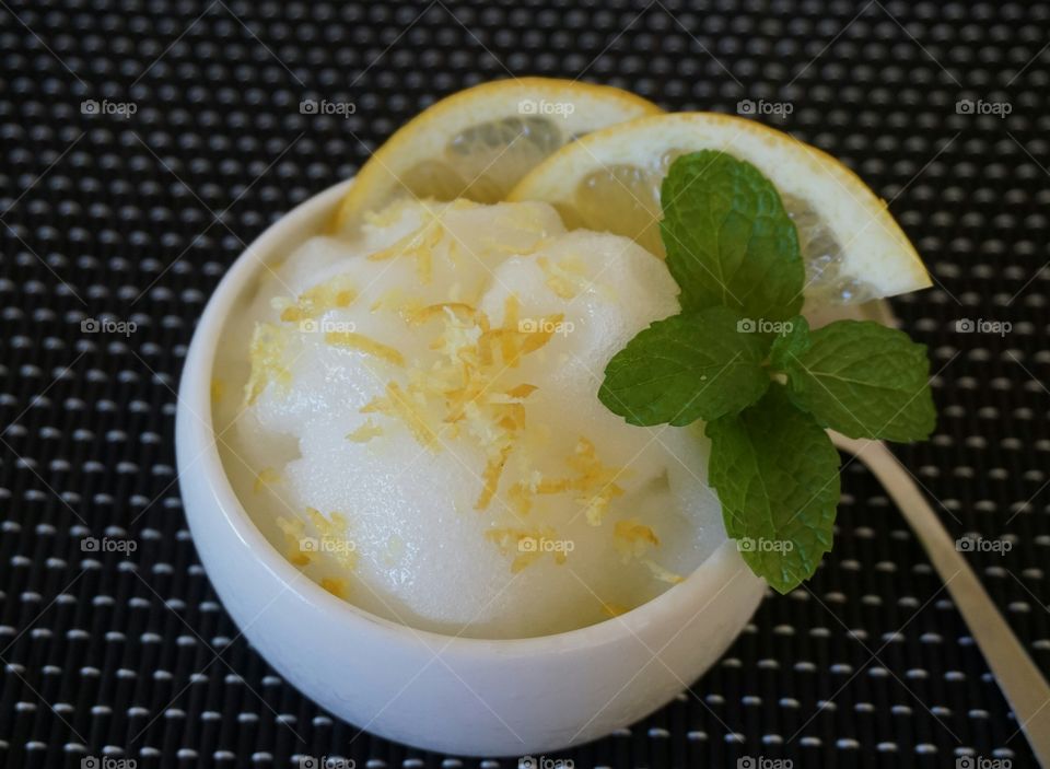 Lemon sorbet in white bowl