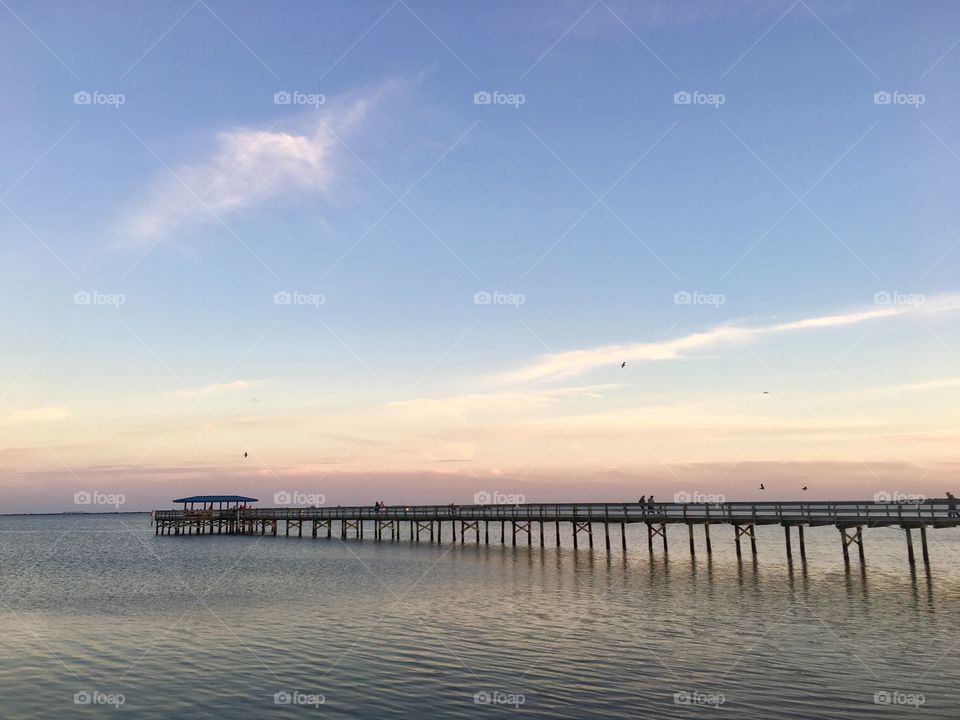 Pier over the sea during sunset