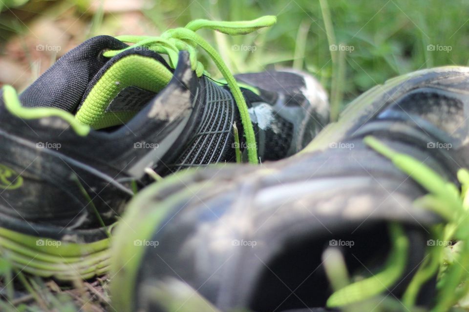Running shoes in the grass during a hike