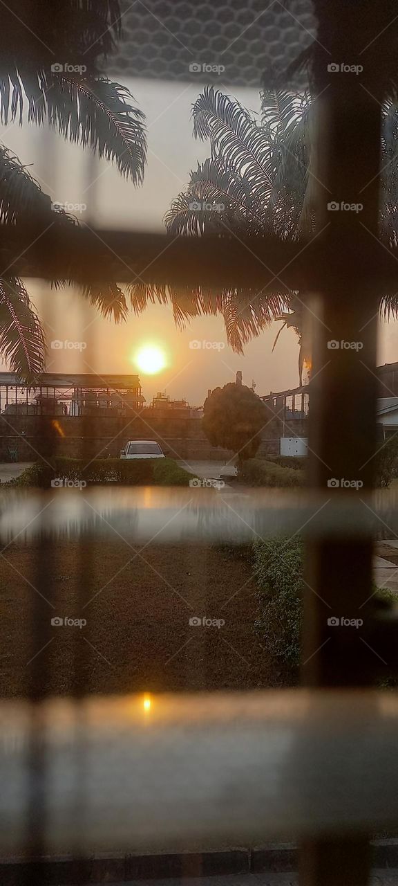 Perfect sunset  viewed from window blinds