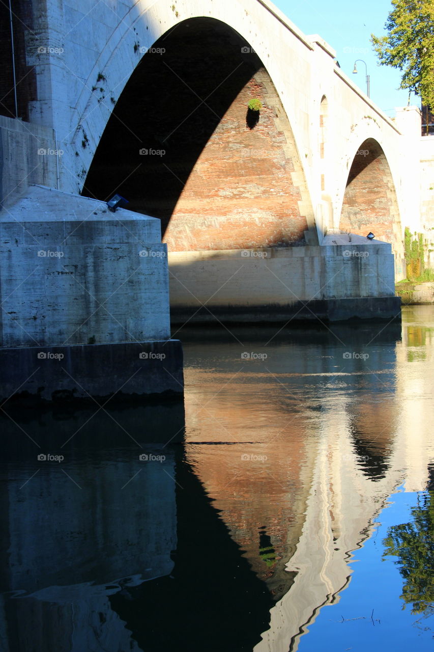 bridge arches reflection into the water